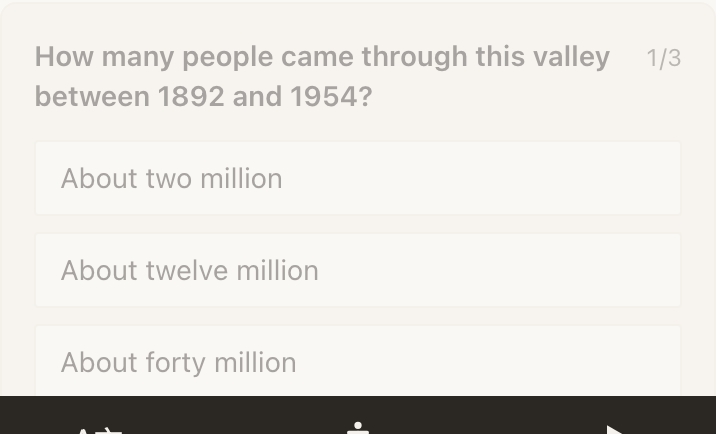 A Quiz block on a published page, showing the first of three questions. The question “How many people came through this valley between 1892 and 1954?” runs across the top with a small 1/3 counter at its right. Three full-width answer buttons follow: About two million, About twelve million, About forty million. The dark Inclusion Bar sits at the bottom of the screen.